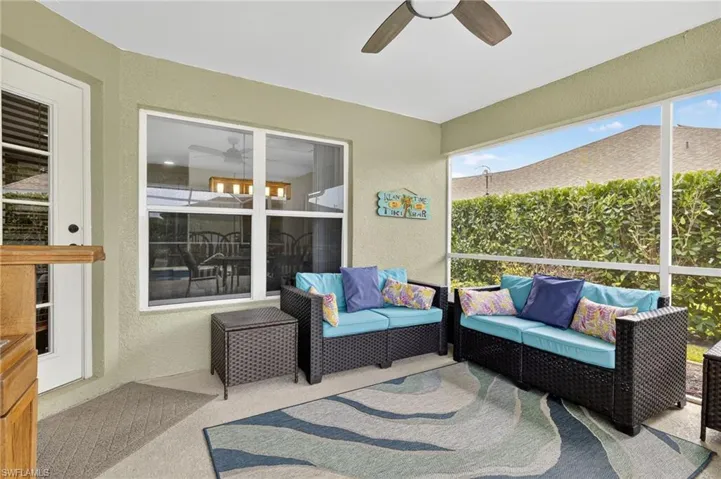 Spacious screened lanai featuring ceiling fan and comfortable outdoor living area — ideal for relaxing or entertaining in Florida's warm climate at 216 NW 29th Ave.