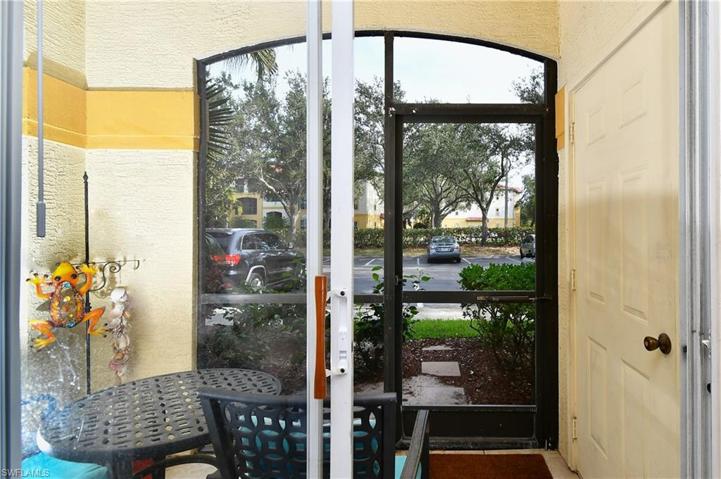 Screened in patio with storage closet door to right