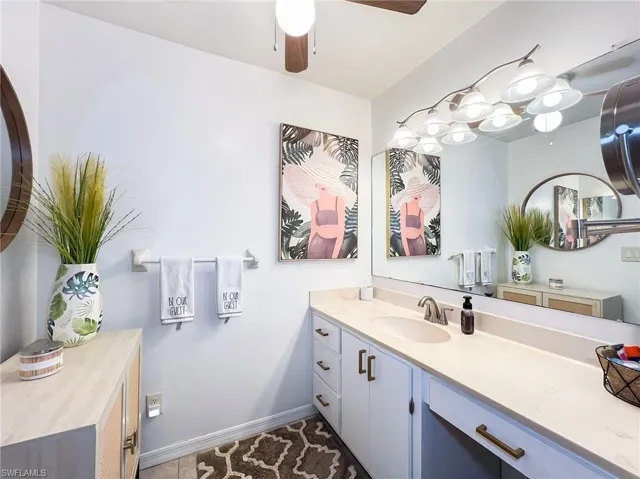 Bathroom featuring ceiling fan and vanity