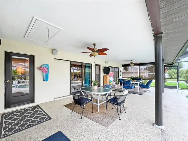 View of patio / terrace featuring baseboard heating and ceiling fan