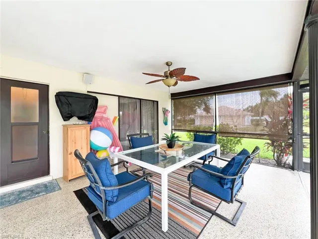 Sunroom / solarium featuring ceiling fan