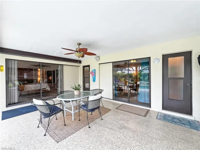 View of patio featuring ceiling fan