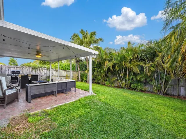 Fenced backyard featuring an outdoor hangout area and a patio area