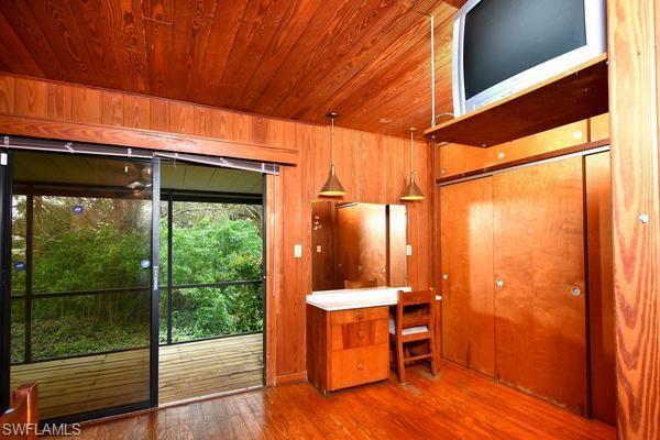 Master bedroom and built in vanity and cedar closets.