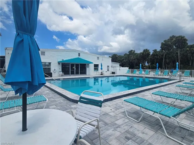 Community pool with a patio area
