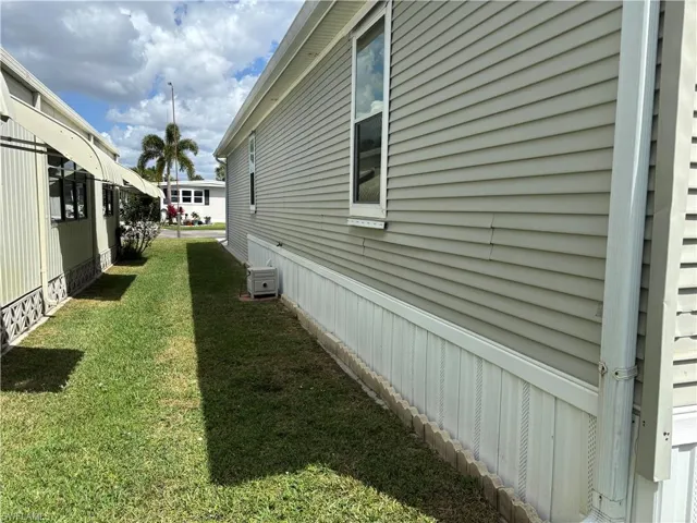 View of home's exterior with a lawn