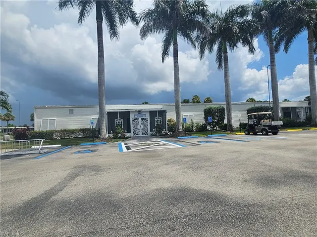 View of property with uncovered parking