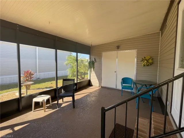 Sunroom / solarium featuring vaulted ceiling
