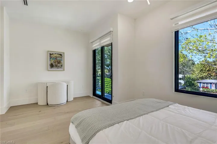 Bedroom featuring light wood-style flooring and access to exterior