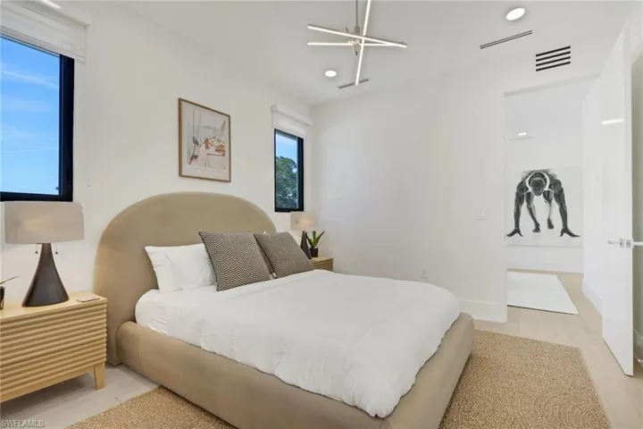 Bedroom with light wood-style floors and baseboards