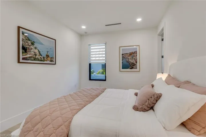 Bedroom with recessed lighting and baseboards