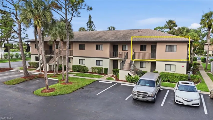 Two story building, unit located on second floor, right hand side corner unit