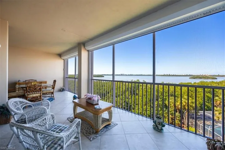 Sunroom with a water view
