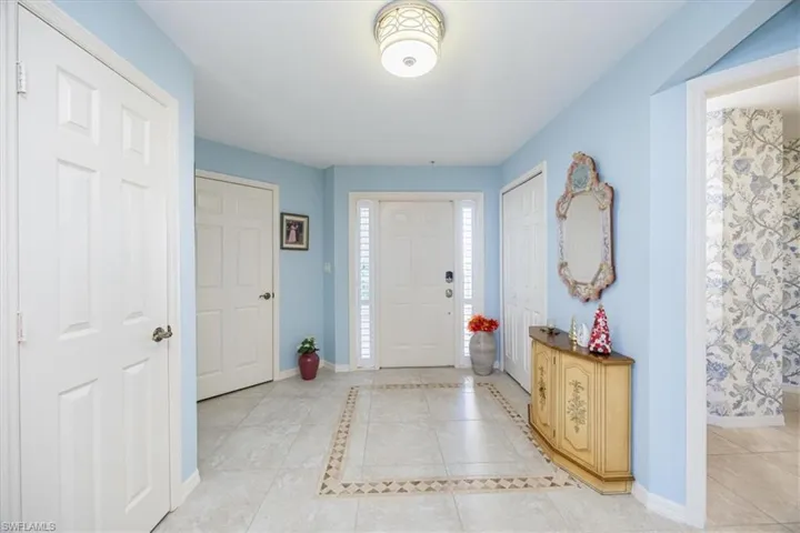 Foyer featuring light tile patterned floors