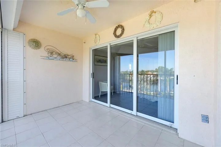 View of patio featuring ceiling fan