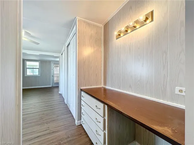 Corridor with wood finished floors