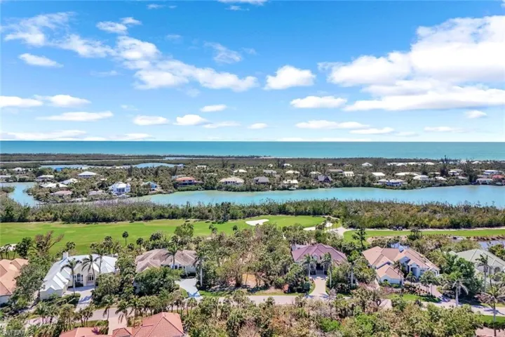 Bird's eye view featuring view of golf course and a water view