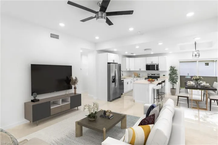 Living room featuring recessed lighting and ceiling fan