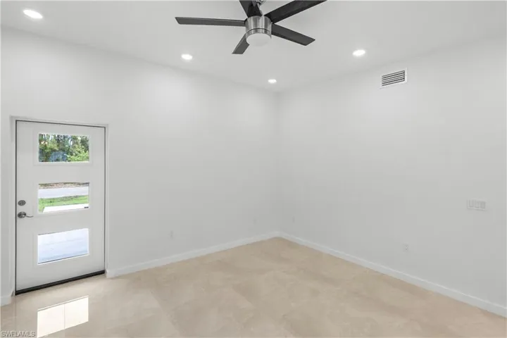 Unfurnished room with recessed lighting and ceiling fan