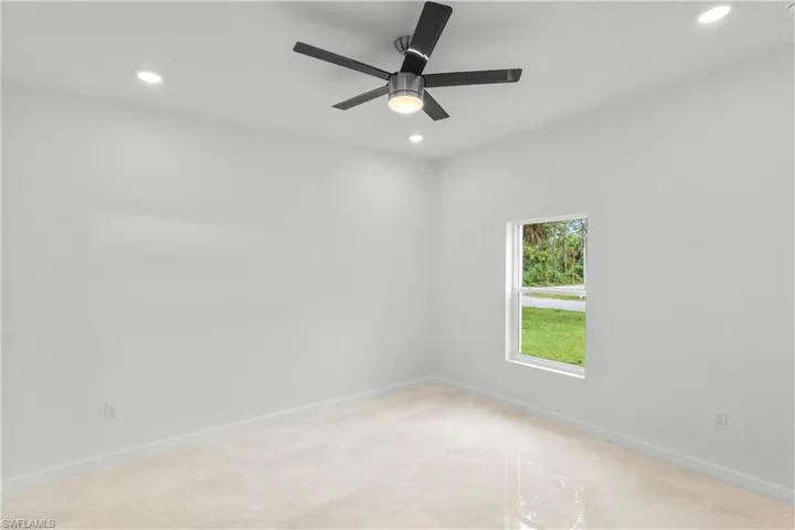 Spare room with recessed lighting and a ceiling fan