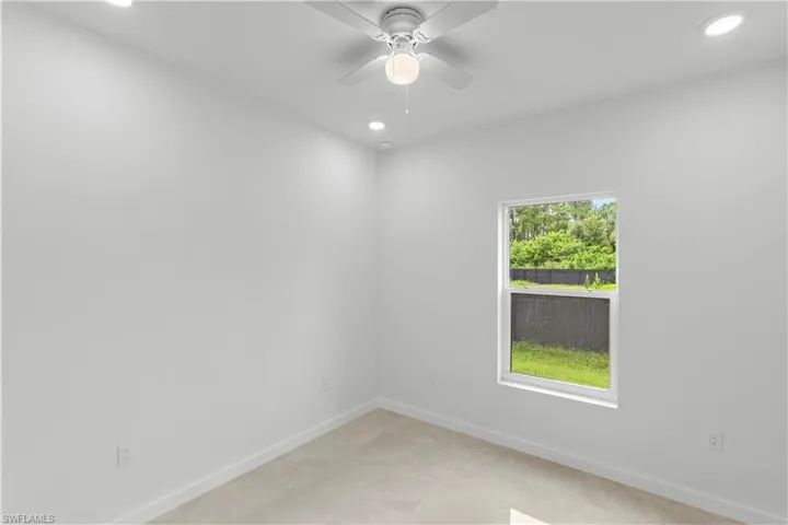Spare room with recessed lighting and a ceiling fan