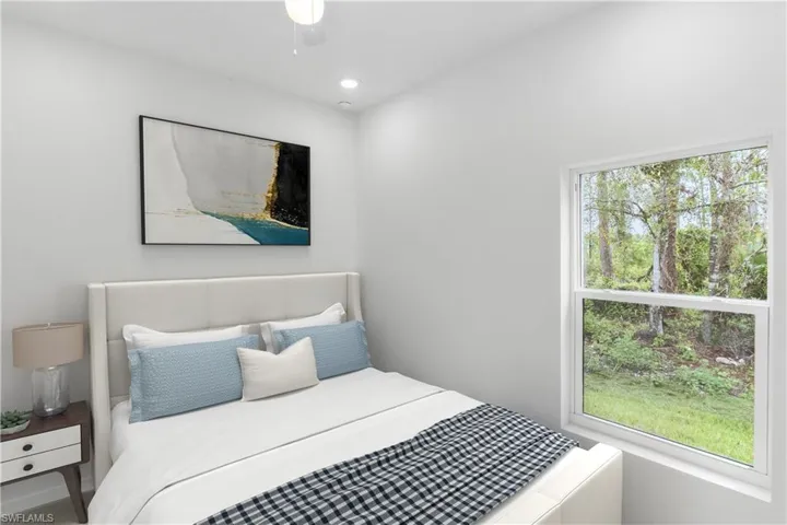 Bedroom with recessed lighting and a ceiling fan