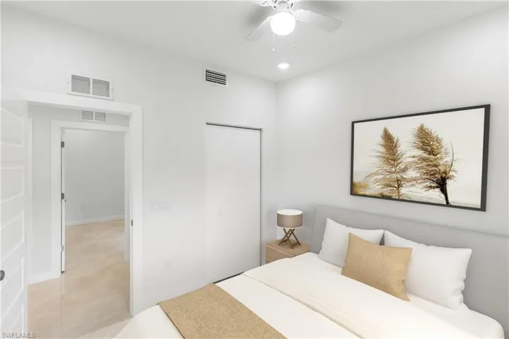 Bedroom with a closet, tile patterned flooring, a ceiling fan, and recessed lighting