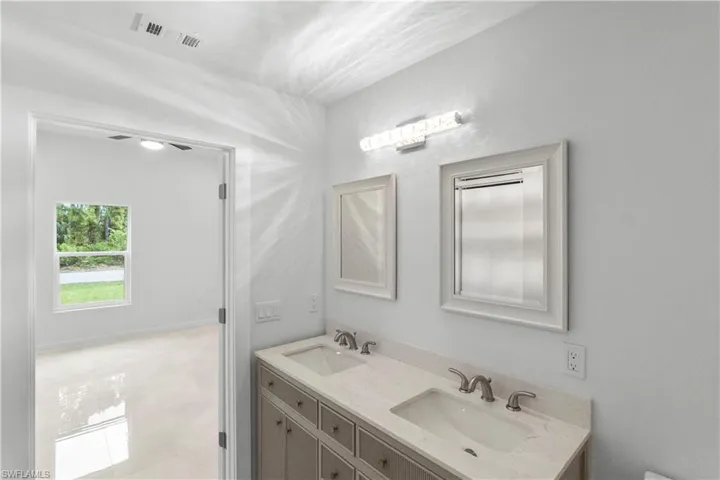 Bathroom featuring double vanity