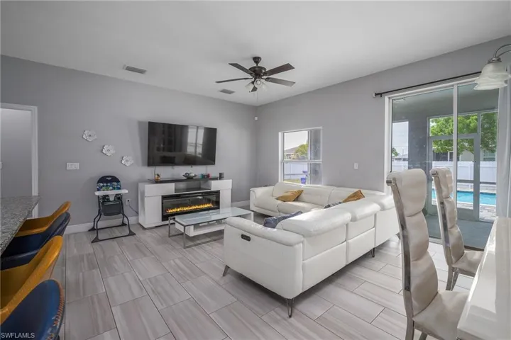 Open-concept living space with light-toned wood-finish flooring