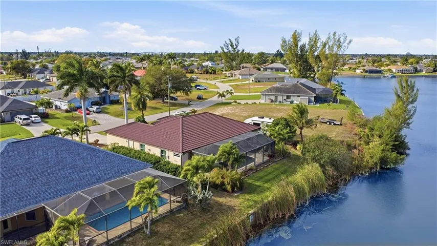 Aerial perspective of suburban area with a large body of water
