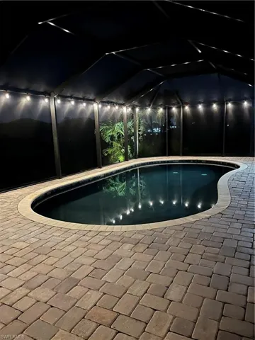 Outdoor pool with glass enclosure