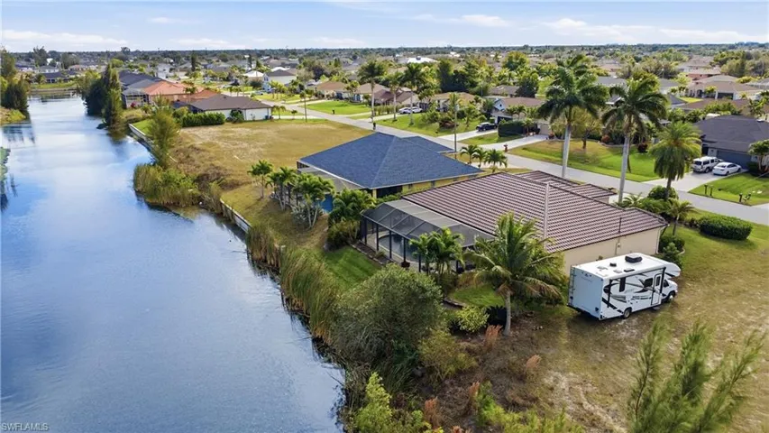 Aerial view of residential area with a nearby body of water