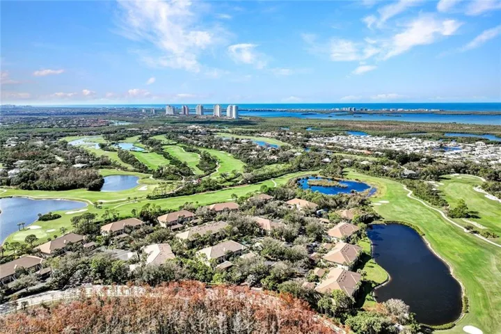 Aerial view of a nearby body of water and a golf course