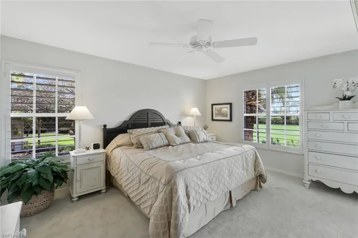 Bedroom featuring carpet and a ceiling fan