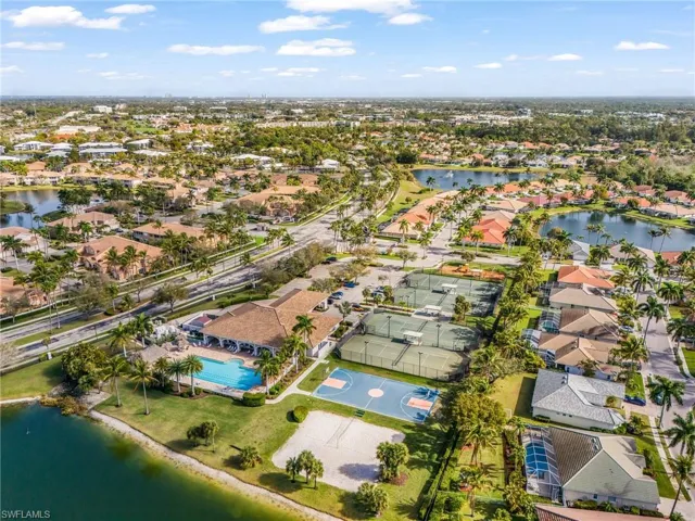 Aerial perspective of suburban area with a large body of water