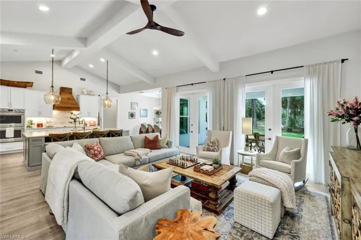 Living room with recessed lighting, french doors, ceiling fan, and light wood finished floors