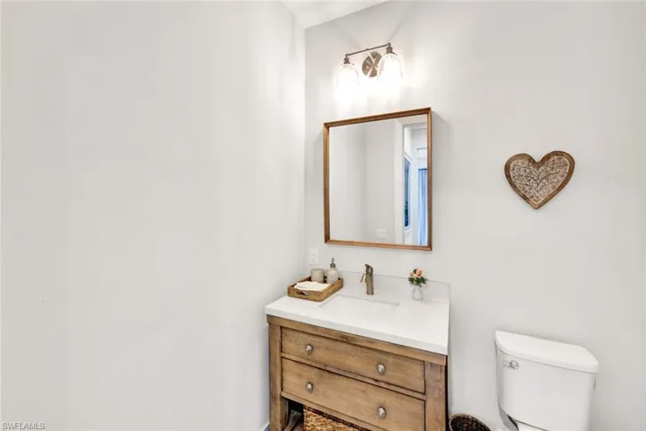 Half bath with vanity and toilet