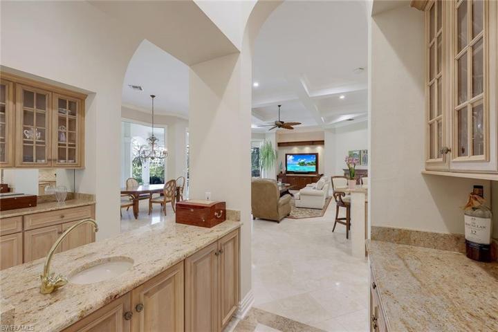 Your happiest of hours will be spent enjoying beverages at the bar in the center of the home.