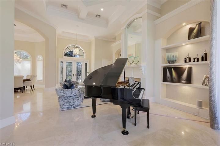 Polished marble flooring throughout the main living area of the home.