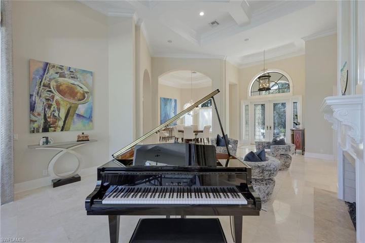 Currently reserved for this grand piano - the formal living area can provide space for your leisurely pursuits.