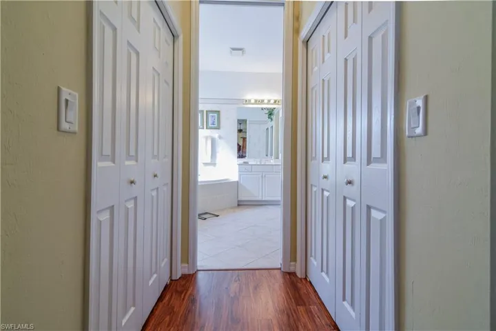Corridor featuring hardwood / wood-style floors