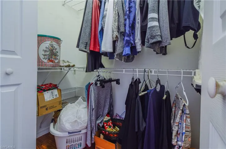 Walk in closet featuring wood-type flooring