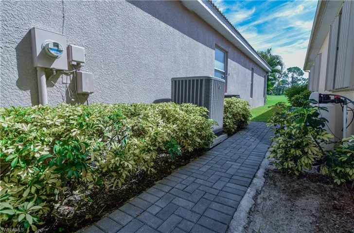 View of property exterior with central air condition unit