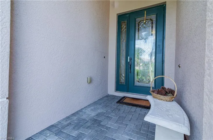 Pavered Front Entry With Leaded Glass Door And Sidelight