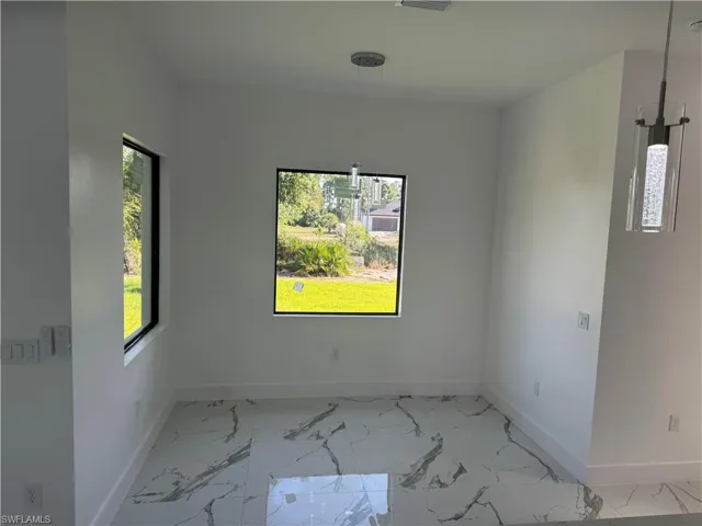 Spare room with tile floors