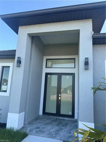 Entrance to property with french doors