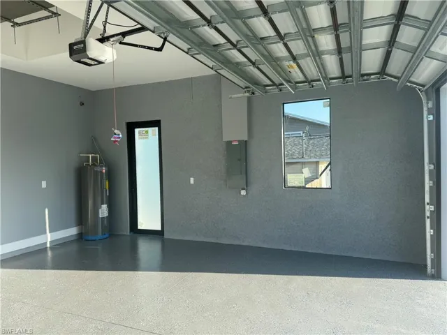 Garage with a garage door opener and water heater