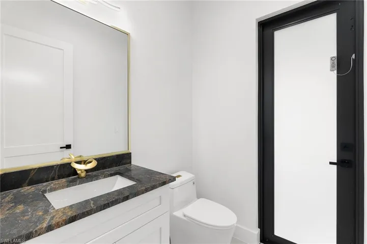 Bathroom with vanity and toilet