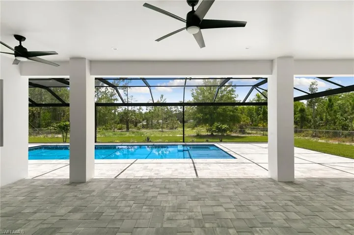 View of swimming pool with ceiling fan