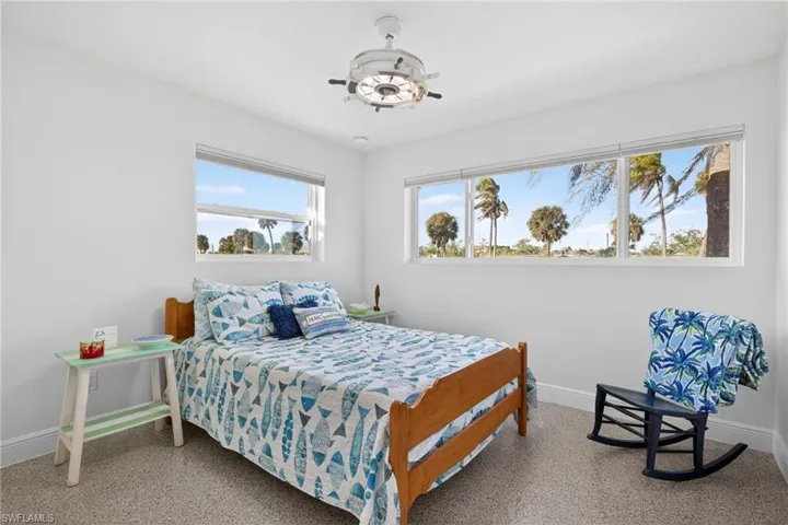Bedroom with baseboards and ceiling fan